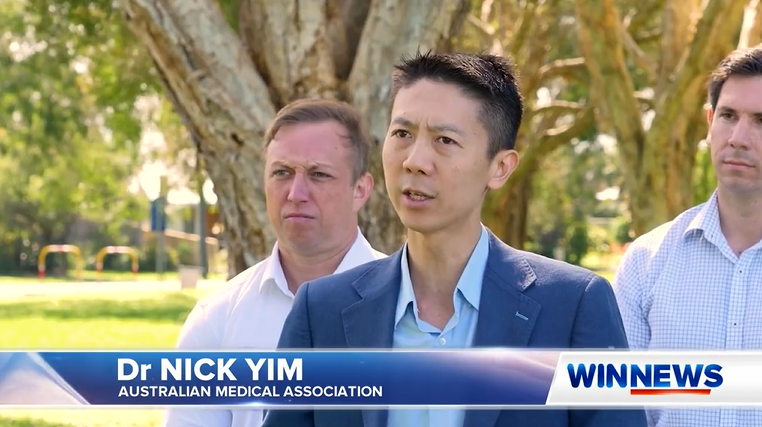 Dr Nick Yim featured on a WIN TV news report. Queensland Opposition Leader Steven Miles stands next to him.