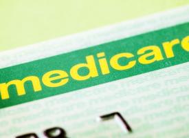 Medicare card on green background