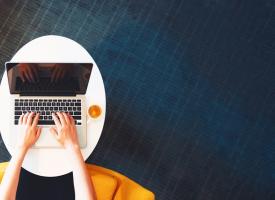 person typing on laptop