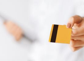 woman holding membership card