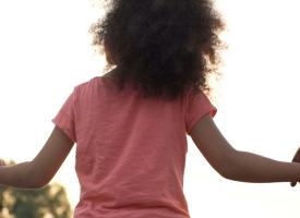 child holding parents hands