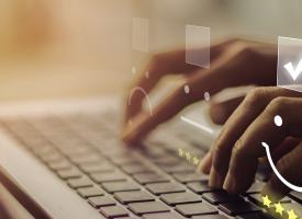 person typing on laptop