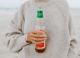 Woman holding an alcoholic beverage