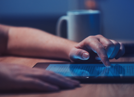 Person scrolling online late at night