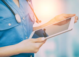 Doctor looking at ipad