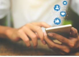 Man holding smart phone looking at social media