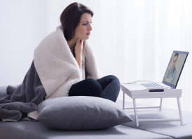 Sick woman on a video call to a doctor