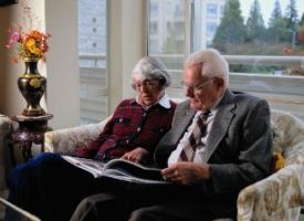 Aged care couple reading