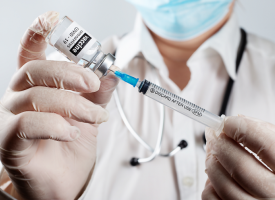 Doctor preparing vaccine