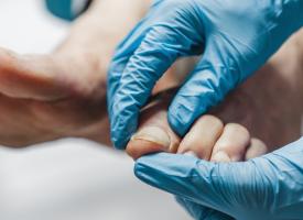 podiatrist examining feet