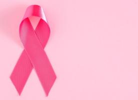 breast cancer ribbon on pink background