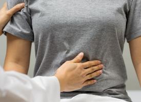 doctor checking female patient