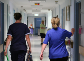 Health workers in a corridor