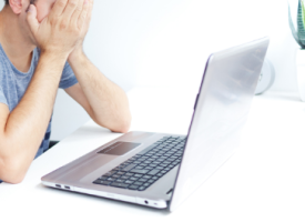 Frustrated person in front of computer