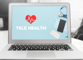 laptop with telehealth written on the screen and a love heart on top of the text