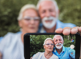 Older couple looking through phone 