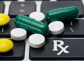 pills on a laptop keyboard