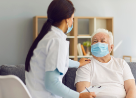 Doctor with elderly man patient 