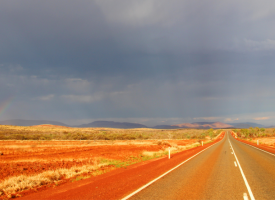 desert road with dark sky 