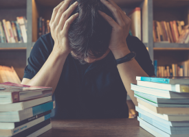 Depressed student in library
