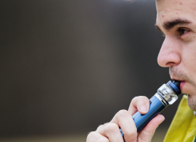 Young man vaping 