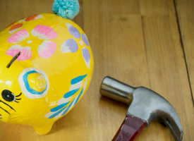 piggy bank with hammer
