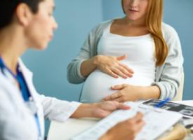 Pregnant woman with doctor