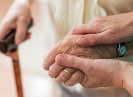 elderly woman being cared for