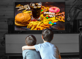 Kids watching junk food tv