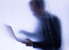 Image of whistleblower with laptop