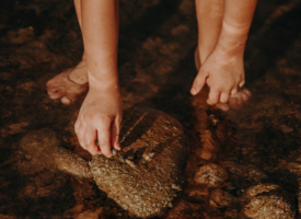 Child playing in creek