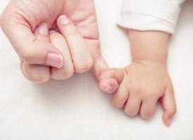 mum and baby hands