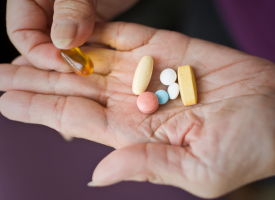 image of pills on a person's hand