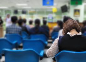 Image of woman in crowded waiting room