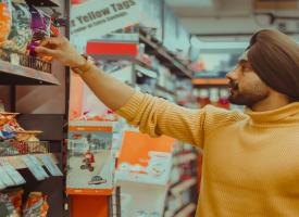 Man picking groceries off shelf