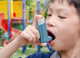 Image of young child with asthma inhaler