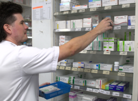 Image of pharmacist stacking shelves