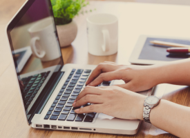 Woman using a laptop at a desk