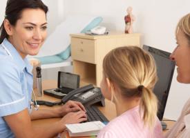 Nurse with female patient and young girl