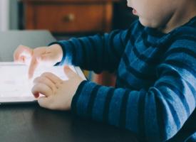 Kid playing with screen