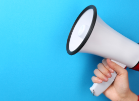 Megaphone against a plain blue background