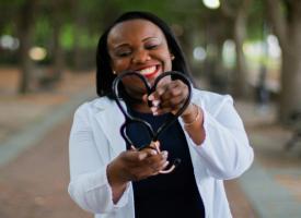 Doctor with stethoscope in love heart