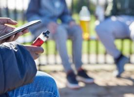Image of young people vaping in playground
