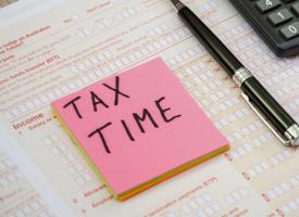 Image of tax return form and calculator