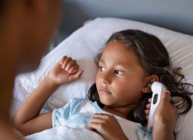 Child having temperature taken