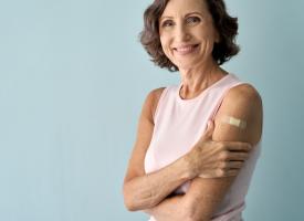 Smiling older woman after vaccination