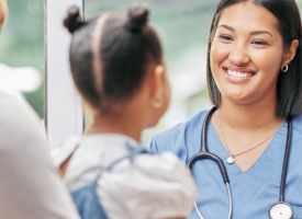 Image of nurse with young girl