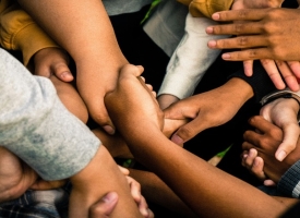 Kids' hands interlocked