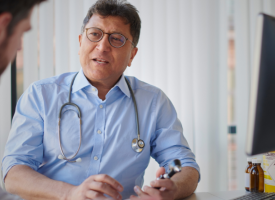 General practitioner doctor speaking with a patient