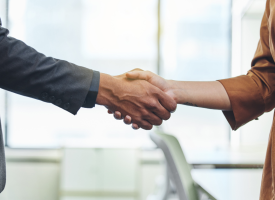 Image of two people shaking hands
